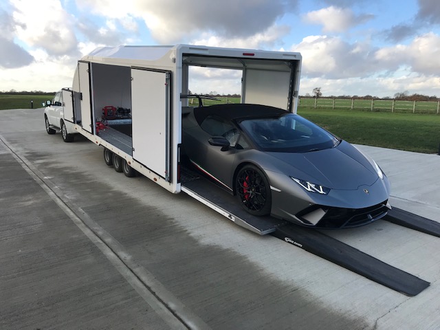 A7 enclosed transporter delivering a Lamborghini Huracán